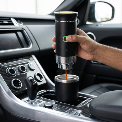 Hand using a portable coffee maker inside a car.